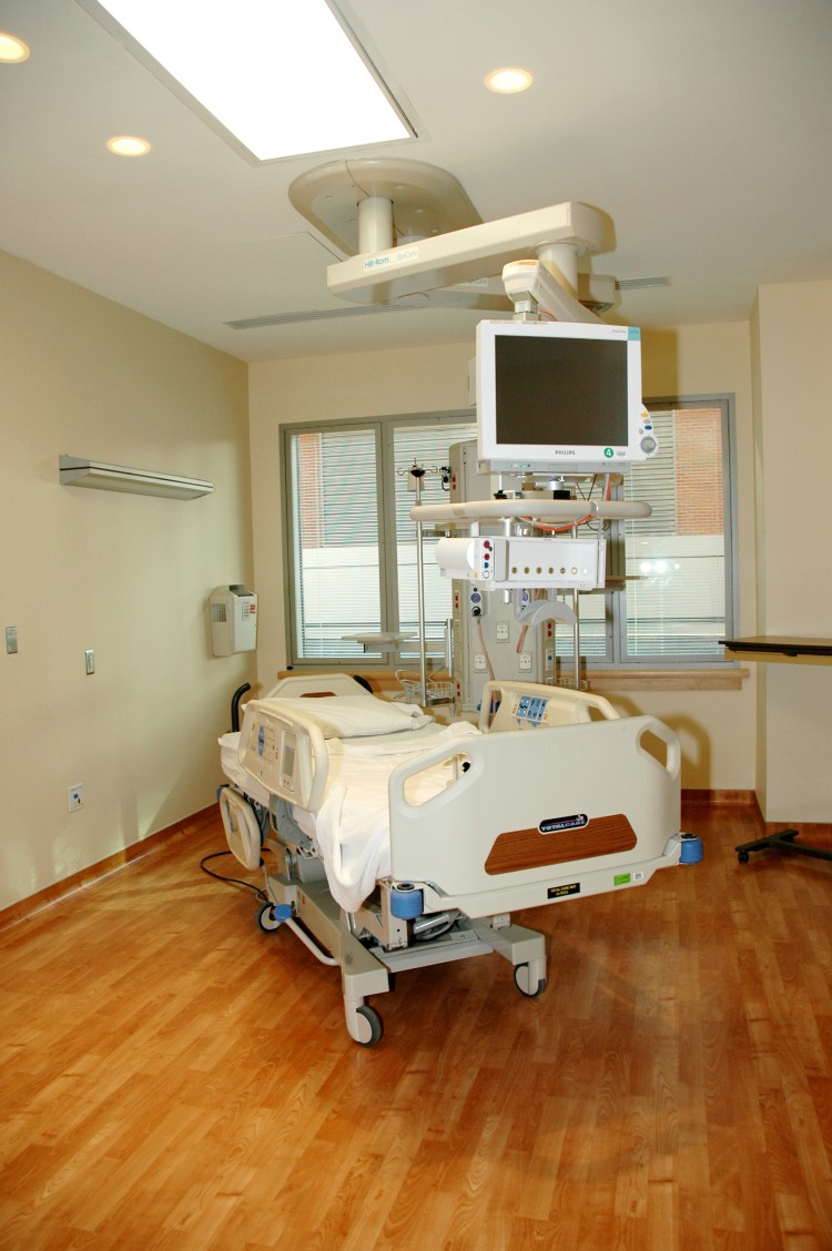 A single empty hospital bed in a patient room, located in the Clinical Research Center, National Institutes of Health (NIH), Bethesda, Md.